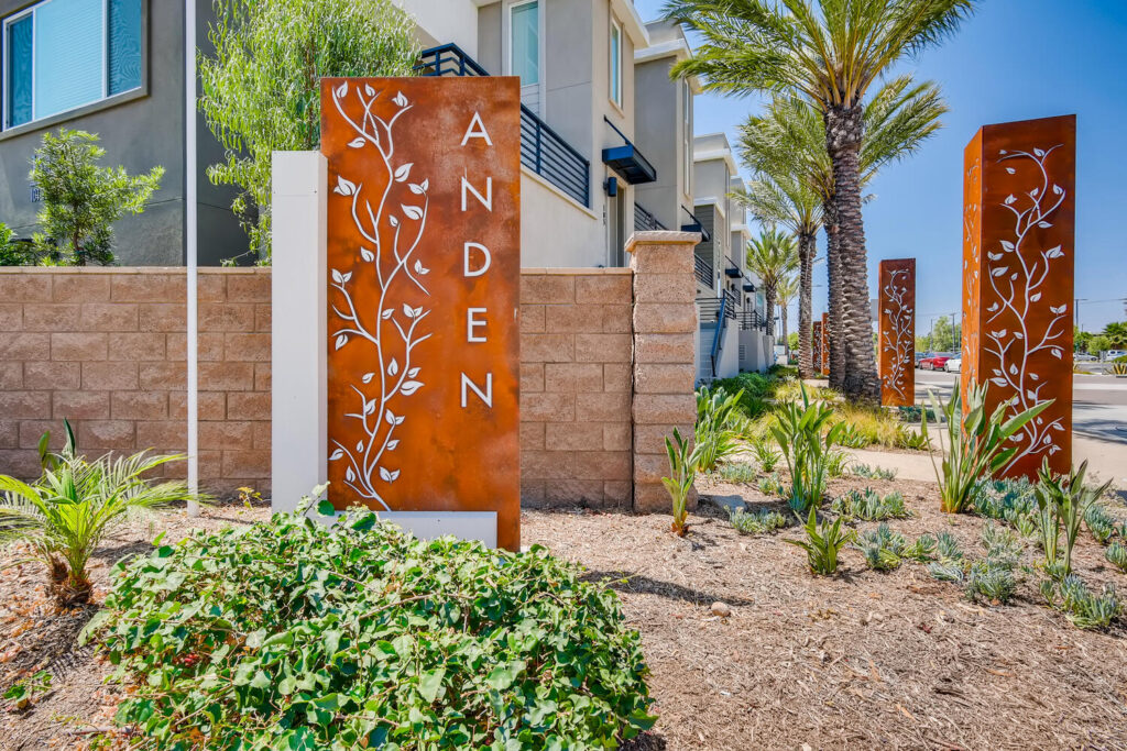 Building exterior with landscaped sidewalk and sculptures