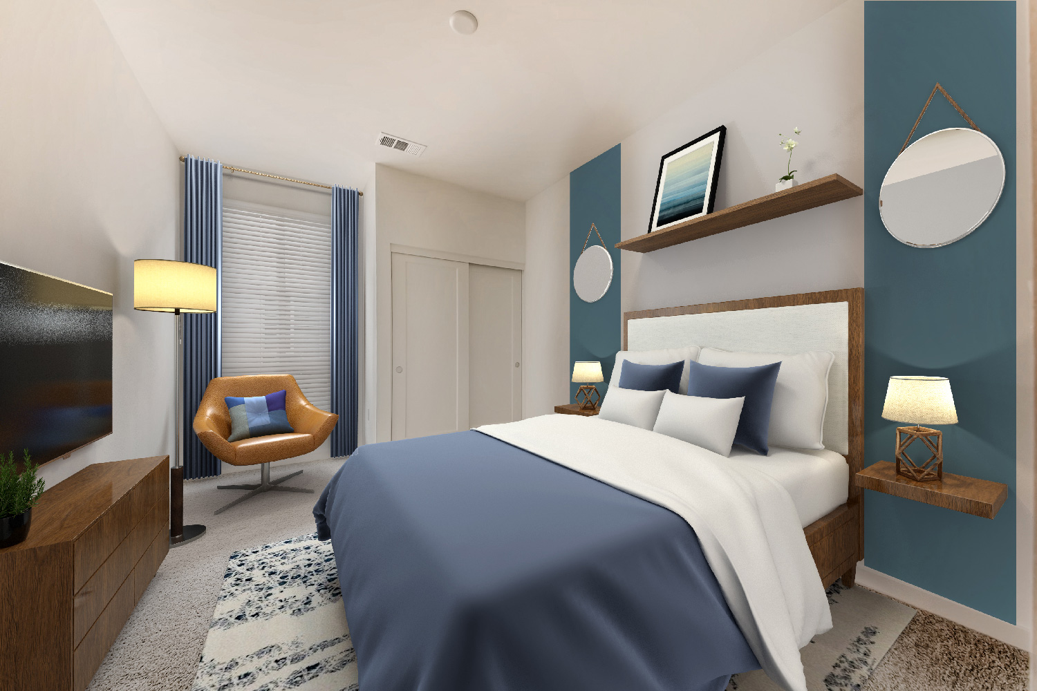 bedroom with a blue and white color scheme, blue comforter, wooden headboard, and brown leather armchair.