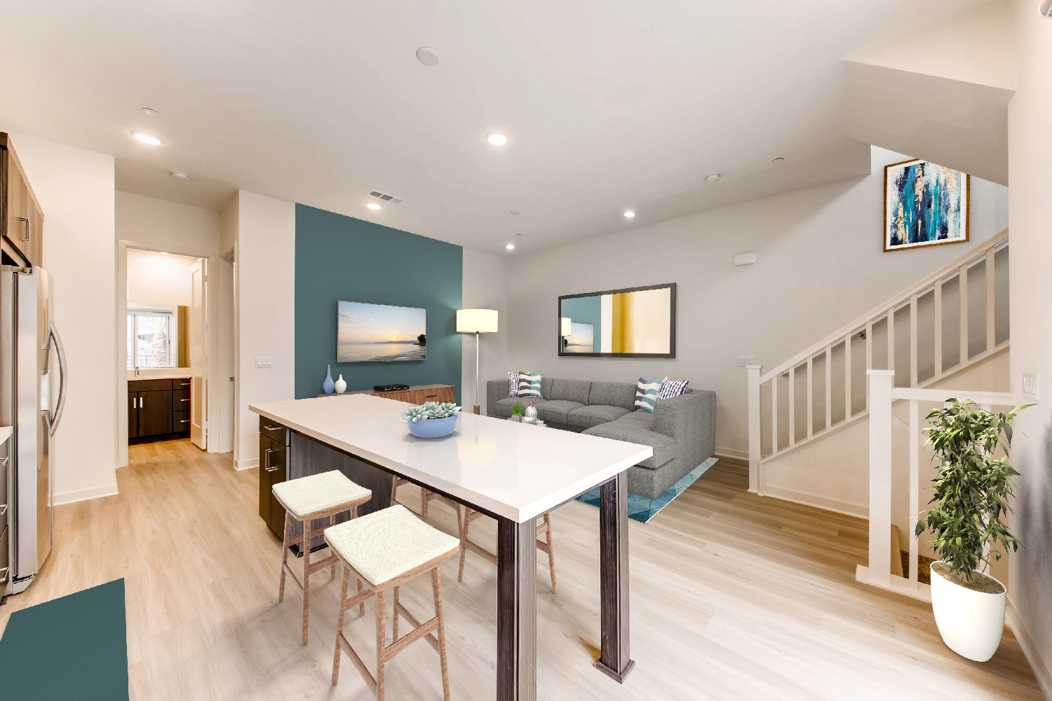 Kitchen with island seating looking into the living room